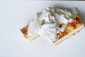 closeup full teaspoon of sour cream is laid out on curd casserole pie sprinkled with sesame seeds Healthy food for kids