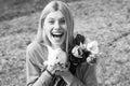 Closeup of funny girl with bunny rabbit. Cheerful and positive girl hold rabbit bunny and celebrating Easter.