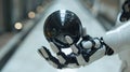 Closeup of futuristic robot hands gently holding a spherical artificial intelligence unit