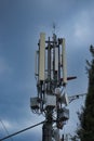 Closeup of a 4g 5g communications mobile tower on top of a hill, antennas for broadcasting signals