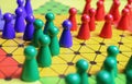 Closeup of gameboard with hexagram, colorful pieces of strategy game sternhalma or chinese checkers