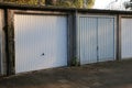 Closeup of garages with swing metal gates