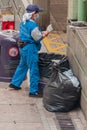 Closeup of garbage collector on street, Hong Kong Island, China