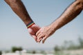 closeup of a gay couple holding hands, Rainbow flag is a symbol of lesbian, gay, bisexual, and transgender. LGTB,LGBT