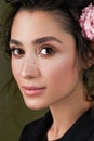 Closeup Gentle beauty portrait of beautiful young female. Girl dressed in black shirt. Gentle makeup. Woman look at camera.