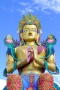 Closeup giant Maitreya Buddha statue with blue sky with clouds.