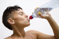 Closeup of girl drinking water after workout