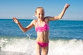 Closeup girl running from sea wave Royalty Free Stock Photo