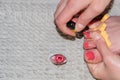 Girl paints her toenails with red nail Polish Royalty Free Stock Photo