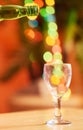 Closeup of a glass against a vibrant bokeh background. One transparent glass on a table. Crockery used to enjoy Royalty Free Stock Photo