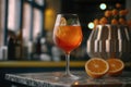 Closeup glass of aperol spritz cocktail decorated with orange at bar background. AI Generation Royalty Free Stock Photo