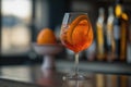 Closeup glass of aperol spritz cocktail decorated with orange at bar background. AI Generation Royalty Free Stock Photo