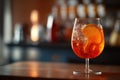 Closeup glass of aperol spritz cocktail decorated with orange at bar background. AI Generation Royalty Free Stock Photo