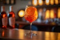 Closeup glass of aperol spritz cocktail decorated with orange at bar background. AI Generation Royalty Free Stock Photo