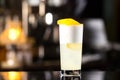 Closeup glass of gin fizz cocktail with lemon and whip eggwhite Royalty Free Stock Photo