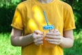 Closeup of glass jar with orange juice in woman`s hand, detox Royalty Free Stock Photo