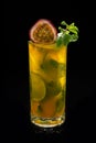 Closeup glass of Mojito with passion fruit  maracuya  lime and green leaf mint isolated Royalty Free Stock Photo