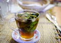 Closeup of a glass of Moroccan mint tea placed on the dining table