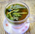 Closeup of a glass of Moroccan mint tea placed on the dining table