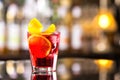 Closeup glass od red alcoholic cocktail decorated with lemon at Royalty Free Stock Photo