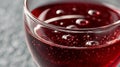 Closeup of a glass of red sparkling wine with bubbles. Royalty Free Stock Photo