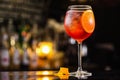 Closeup glass of spritz aperol cocktail decorated with orange