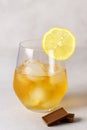 Closeup of Glass with Strong Drink and Snacks such as lemon and hocolate Vertical Royalty Free Stock Photo