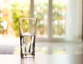 Closeup Glass of water on table in the living room , vintage and retro style Royalty Free Stock Photo