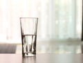 Closeup Glass of water on table in the living room , vintage and retro style Royalty Free Stock Photo