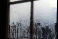 Closeup of a glass window with moisture and trickling water drops Royalty Free Stock Photo