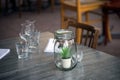 glasses and decoration on the table at the restaurant terrasse in the street Royalty Free Stock Photo