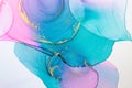 Closeup of gold, blue and pink alcohol ink abstract texture, trendy wallpaper. Art for design project as background for