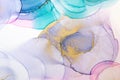 Closeup of gold, blue and pink alcohol ink abstract texture, trendy wallpaper. Art for design project as background for