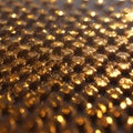 Closeup of golden bubblewrap with gold dust