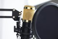 Closeup of golden microphone in recording studio Royalty Free Stock Photo