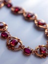 Golden necklace with red ruby gemstones. Royalty Free Stock Photo