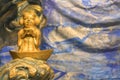 Closeup on golden sculpture of Japanese fishermen god Ebisu Sukunabikona-no-mikoto in Kanda Myojin. Royalty Free Stock Photo