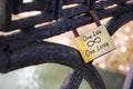 Closeup of golden wedding lock on iron rusty fence with One Love one Life text Royalty Free Stock Photo