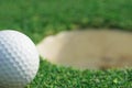 closeup on a golf ball on lip of cup Royalty Free Stock Photo