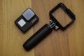 Closeup of Gopro 7 black assorted accessories on wooden background with copyspace Royalty Free Stock Photo