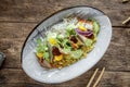 Closeup on gourmet bowl of unagi eel and couscous