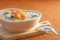 Closeup Gourmet Cream Soup with Shrimp and Onion