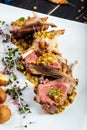 Closeup on gourmet fried lamb chops with sauce