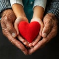 Hands of an Elderly Man and a Child Holding a Red Heart - Generative Ai Royalty Free Stock Photo