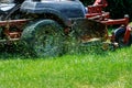 Closeup of grassmower mowing the grass