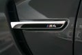 Closeup of gray BMW M4 Side Air Outlet and Badge