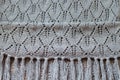 Closeup on gray detail of woven handicraft knit shawl