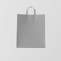 Closeup Gray Kraft Paper Bag Isolated Center White Empty Background.Mockup Highly Detailed Texture Materials.Space for