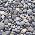 Closeup gray pebbles scattered on a peaceful beach
