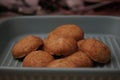 Closeup of a gray plate of mazola biscuits made from peanuts Royalty Free Stock Photo